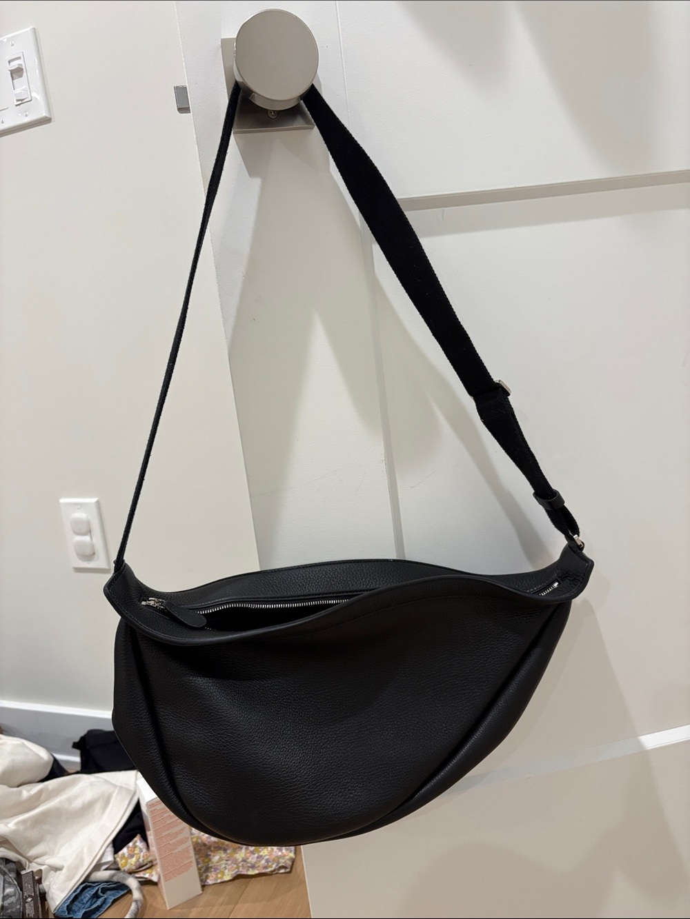 The Row black leather banana bag